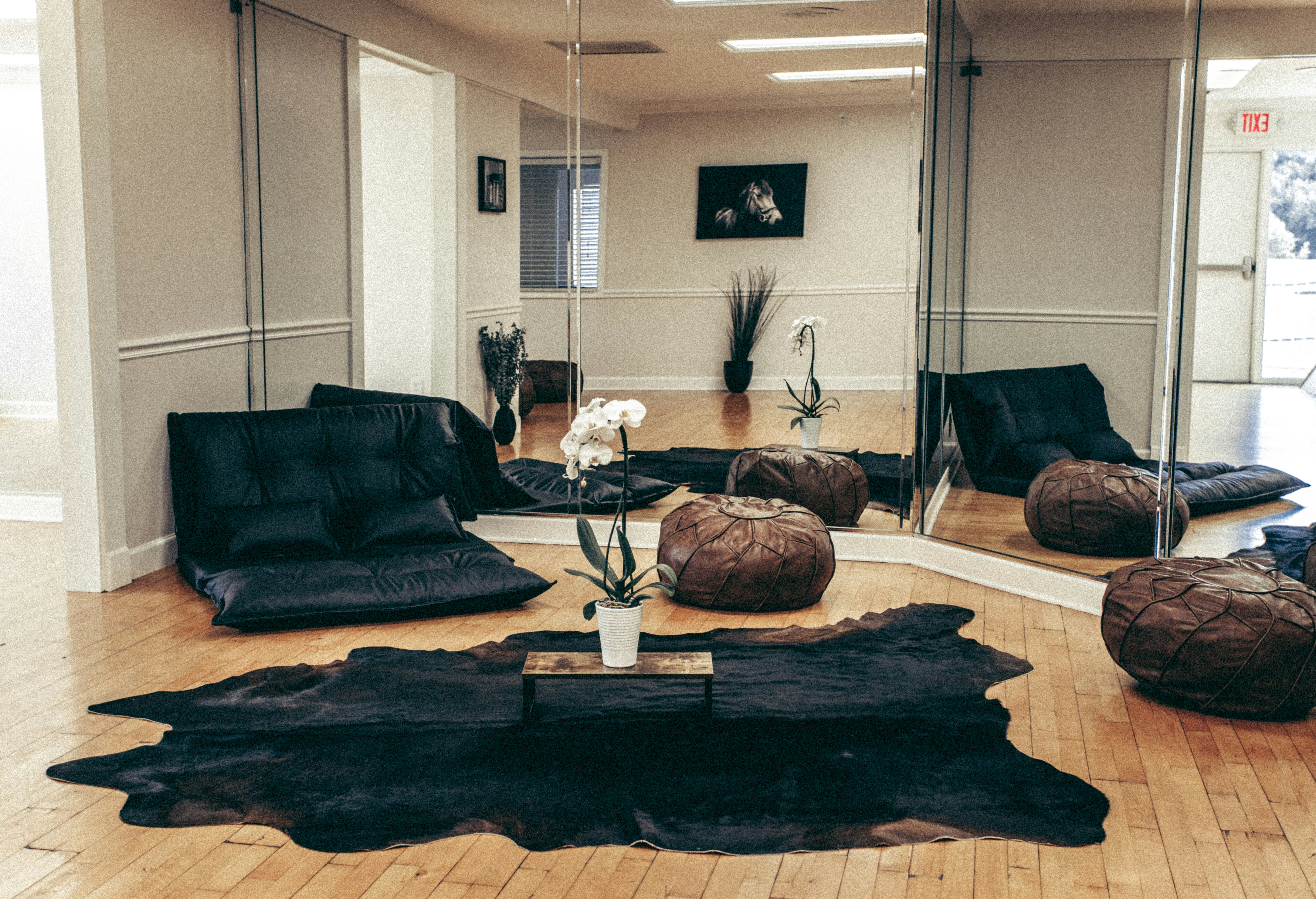 black sofa near brown wooden coffee table